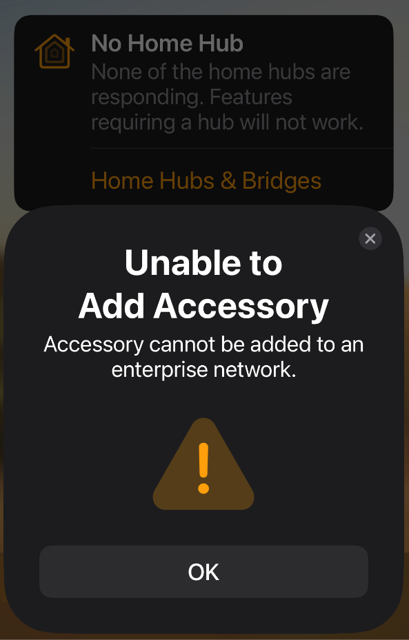 A screenshot of the iOS Home App with a Popup: Unable to add Accessory, Accessory cannot be added to an enterprise network.